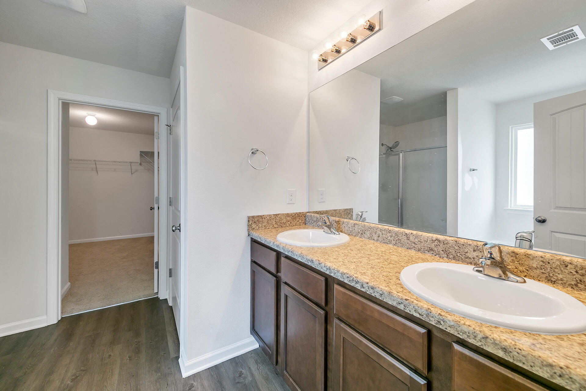 4624 Plover Drive Crestview, FL 32539 - Photo 30 of 34 a bathroom with a granite countertop sink and a mirror