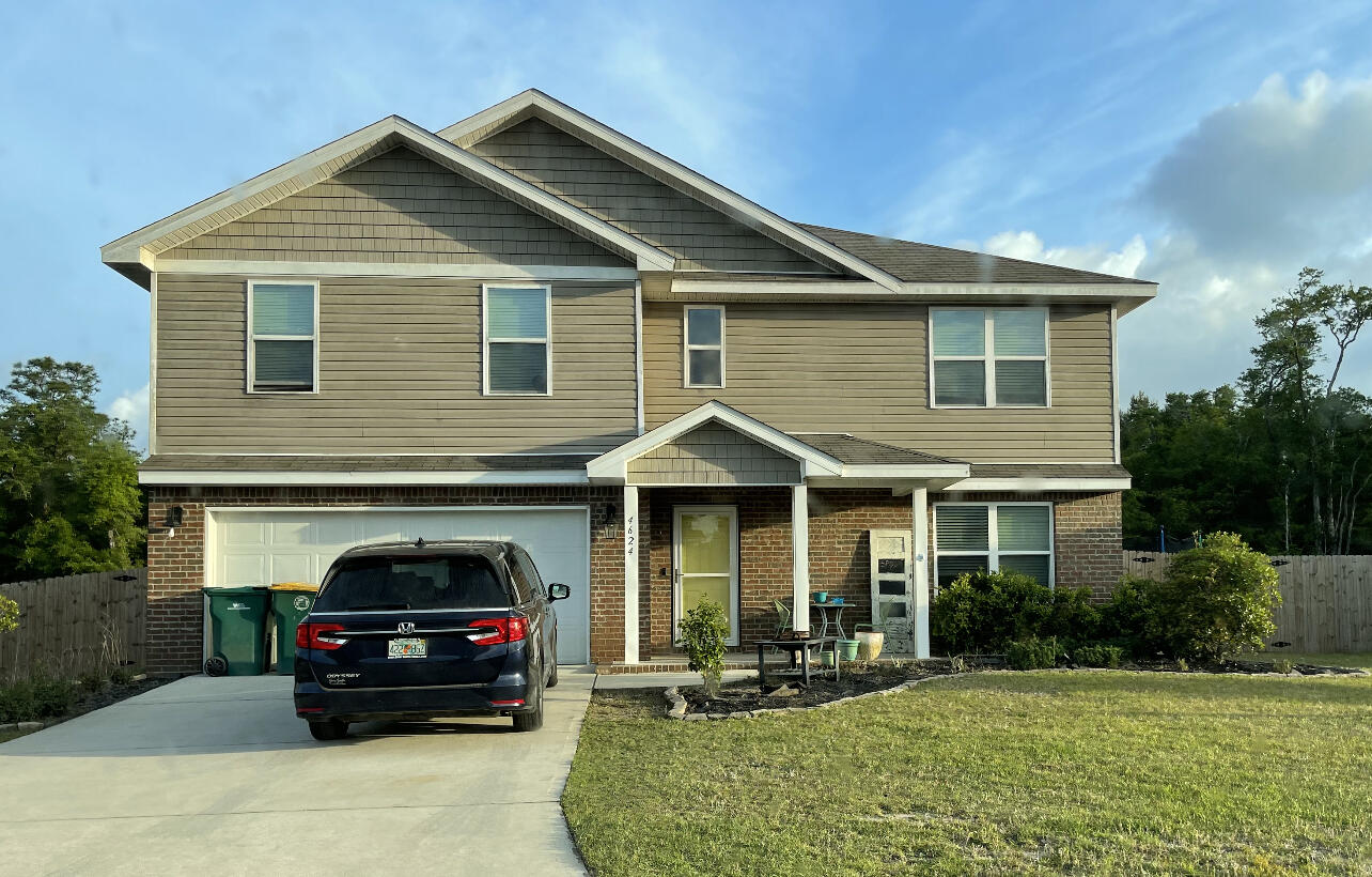 4624 Plover Drive Crestview, FL 32539 - Photo 3 of 34 a car parked in front of white house