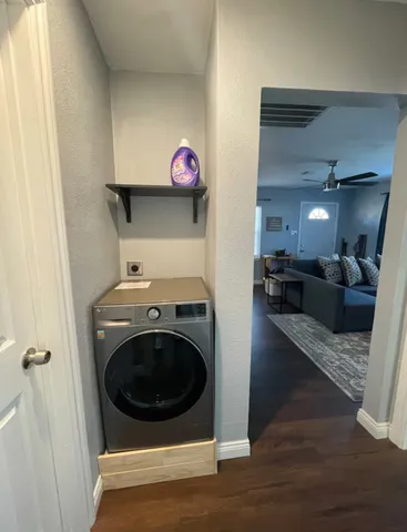 a view of a hallway with washer and dryer