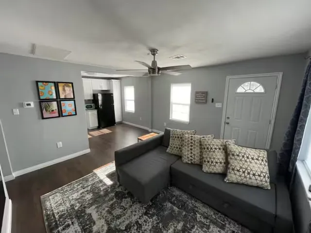 a living room with furniture and window