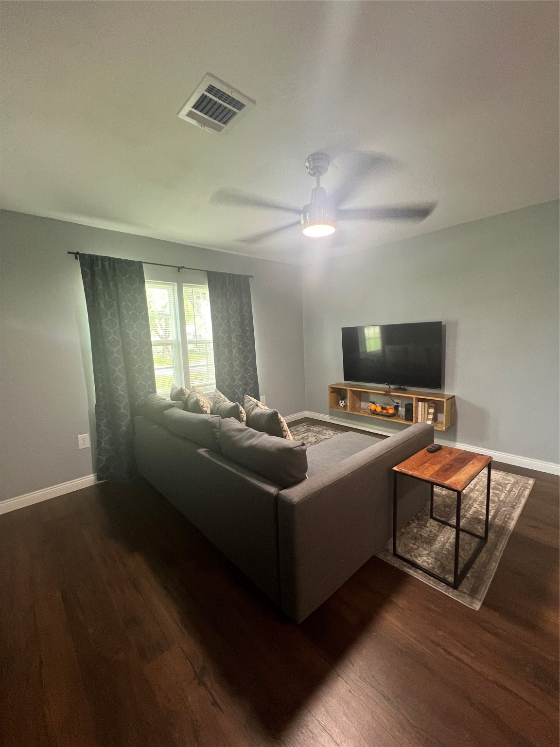 3001 Austin Street Vidor, TX 77662 - Photo 6 of 14 a living room with furniture and a flat screen tv