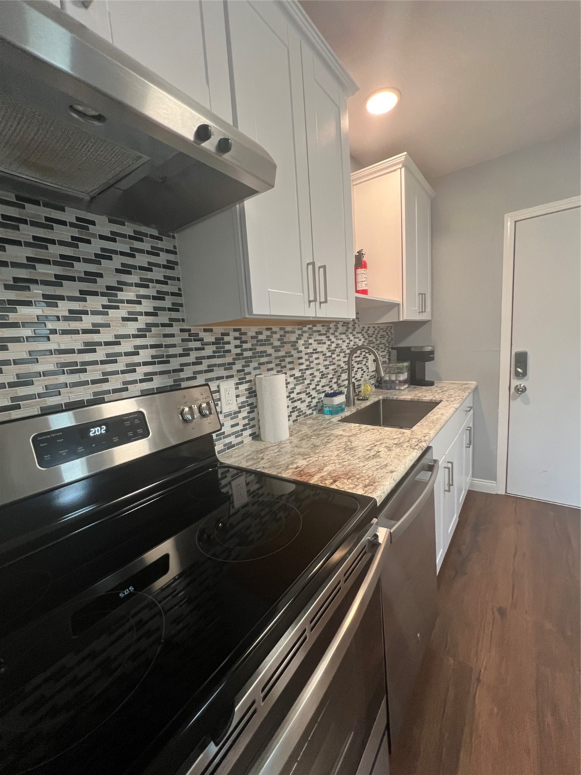 3001 Austin Street Vidor, TX 77662 - Photo 8 of 14 a kitchen with a stove and a sink