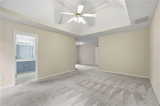 wooden floor in an empty room with a bathroom