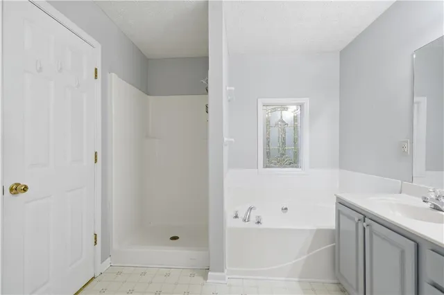 a bathroom with a bathtub and a sink