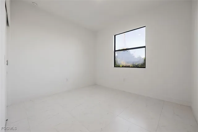 an empty room with a mirror