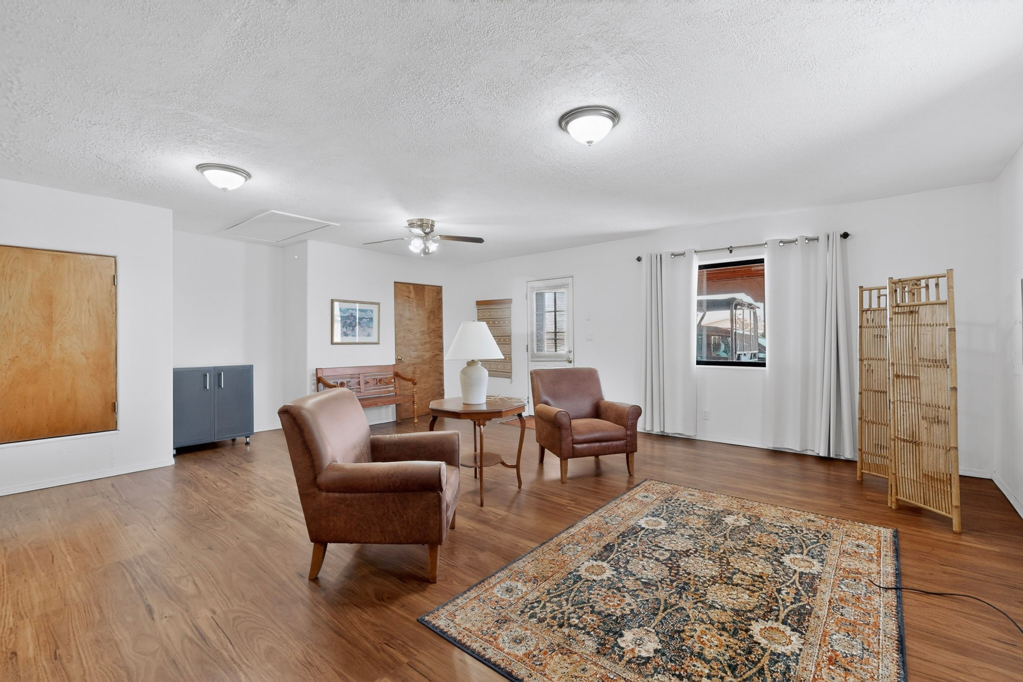 10 Blue Mesa Road Santa Fe, NM 87508 - Photo 26 of 63 The family room has outside acess and a carport