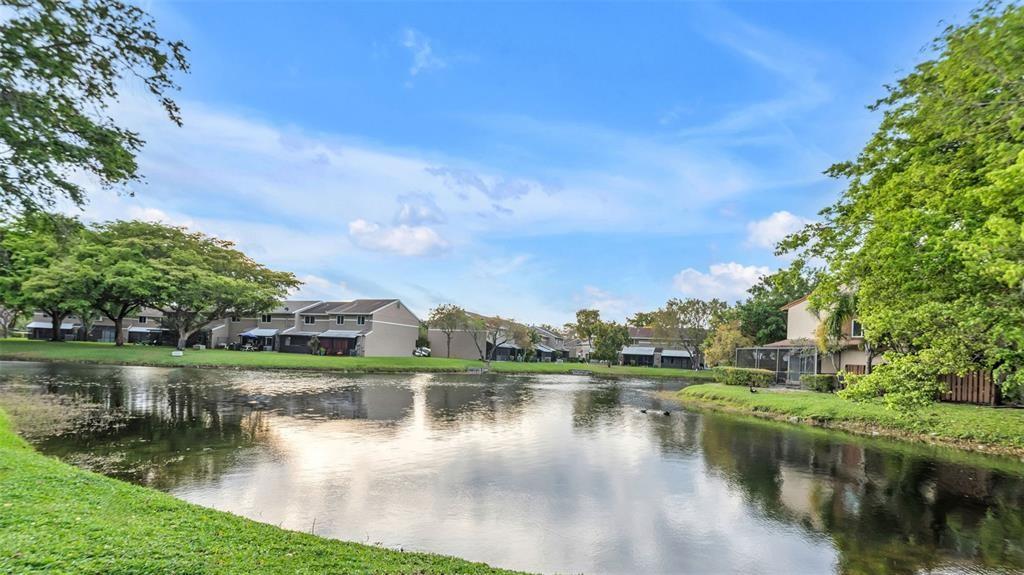 1153 Hampton Boulevard North Lauderdale, FL 33068 - Photo 5 of 10 a view of a lake with houses in the background