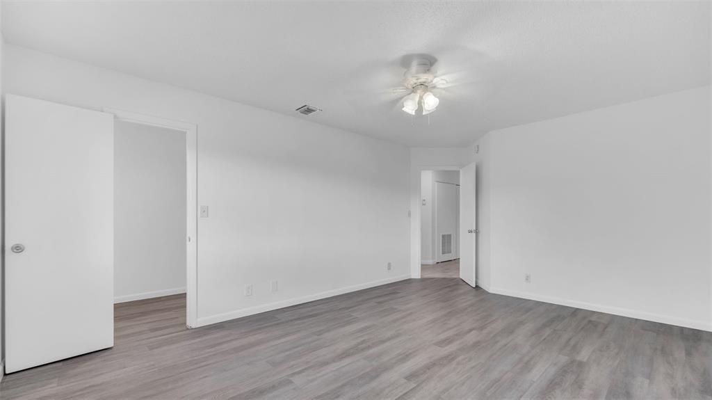 1153 Hampton Boulevard North Lauderdale, FL 33068 - Photo 7 of 10 a view of an empty room with wooden floor