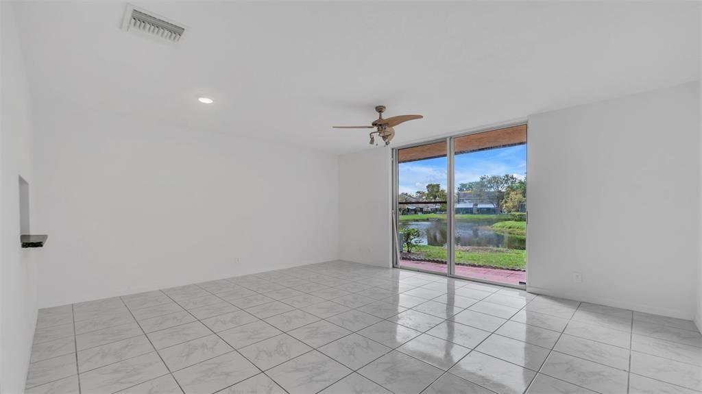 1153 Hampton Boulevard North Lauderdale, FL 33068 - Photo 9 of 10 a view of an empty room and a window