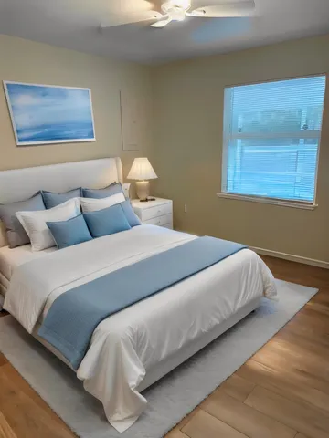 a bedroom with bed and window