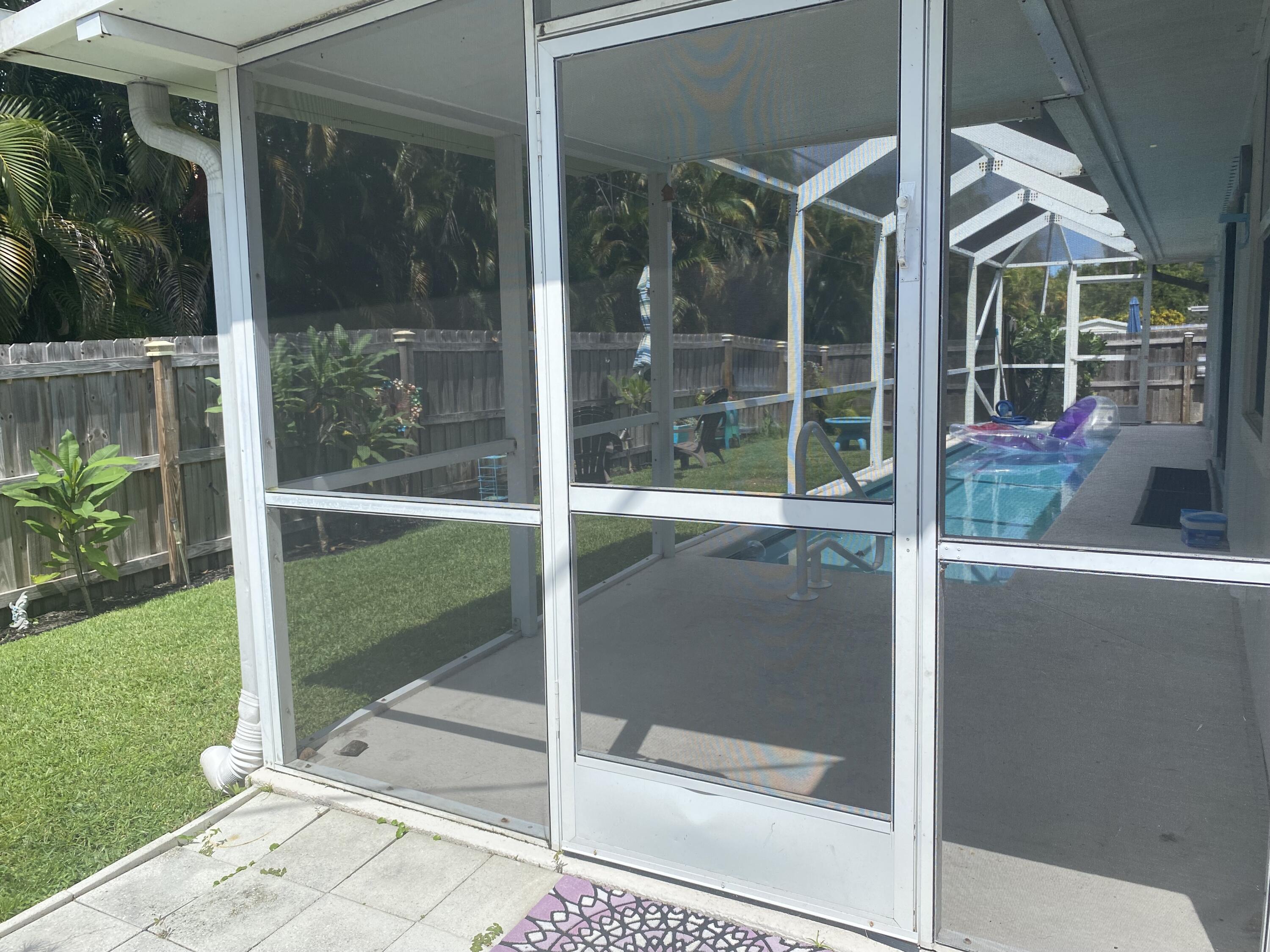 3196 Southwest Areca Drive Palm City, FL 34990 - Photo 20 of 21 a house view with a glass door