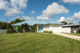 3196 Southwest Areca Drive Palm City, FL 34990 - Photo 2 of 21 a view of a house with a yard and garage