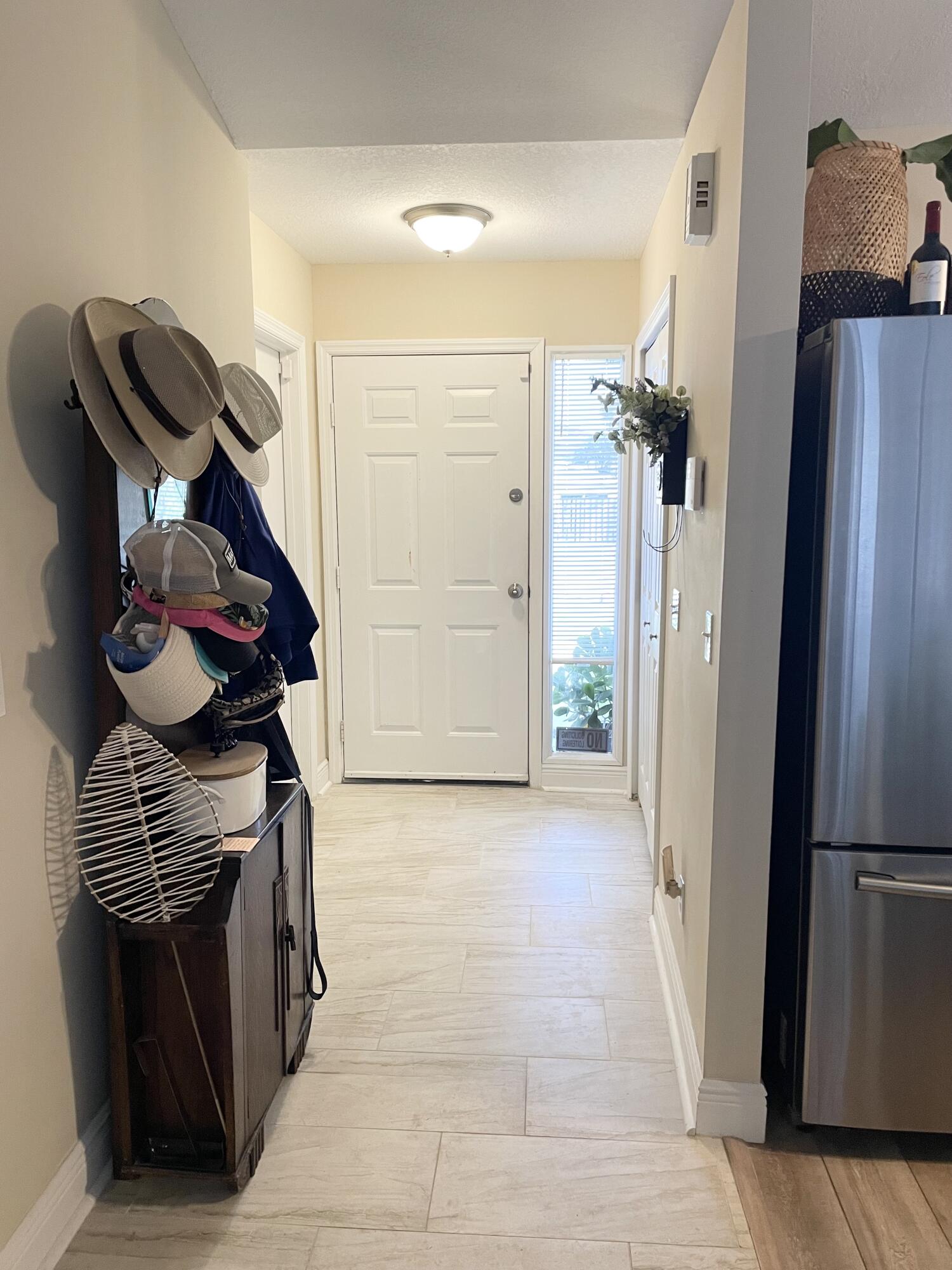 3196 Southwest Areca Drive Palm City, FL 34990 - Photo 5 of 21 a view of hallway with cabinets and wooden floor