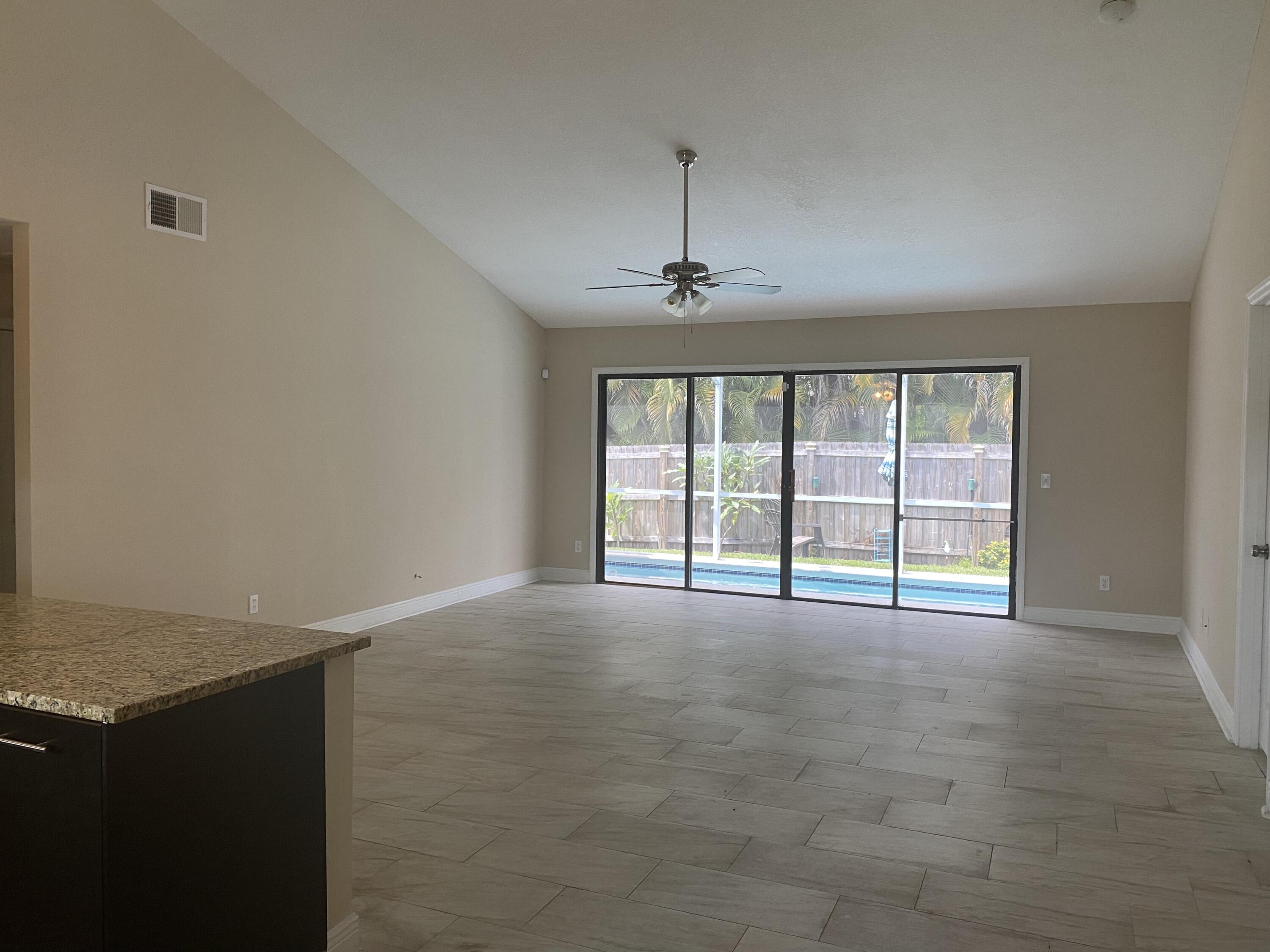3196 Southwest Areca Drive Palm City, FL 34990 - Photo 7 of 21 a view of an empty room with a window