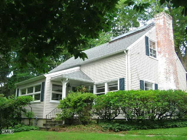 69 Briar Brae Road Stamford, CT 06903 - Photo 1 of 1 a front view of a house with a yard