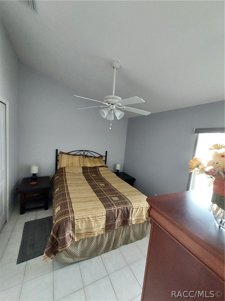 9306 East Gospel Island Road Inverness, FL 34450 - Photo 6 of 16 a bedroom with a bed and a chandelier