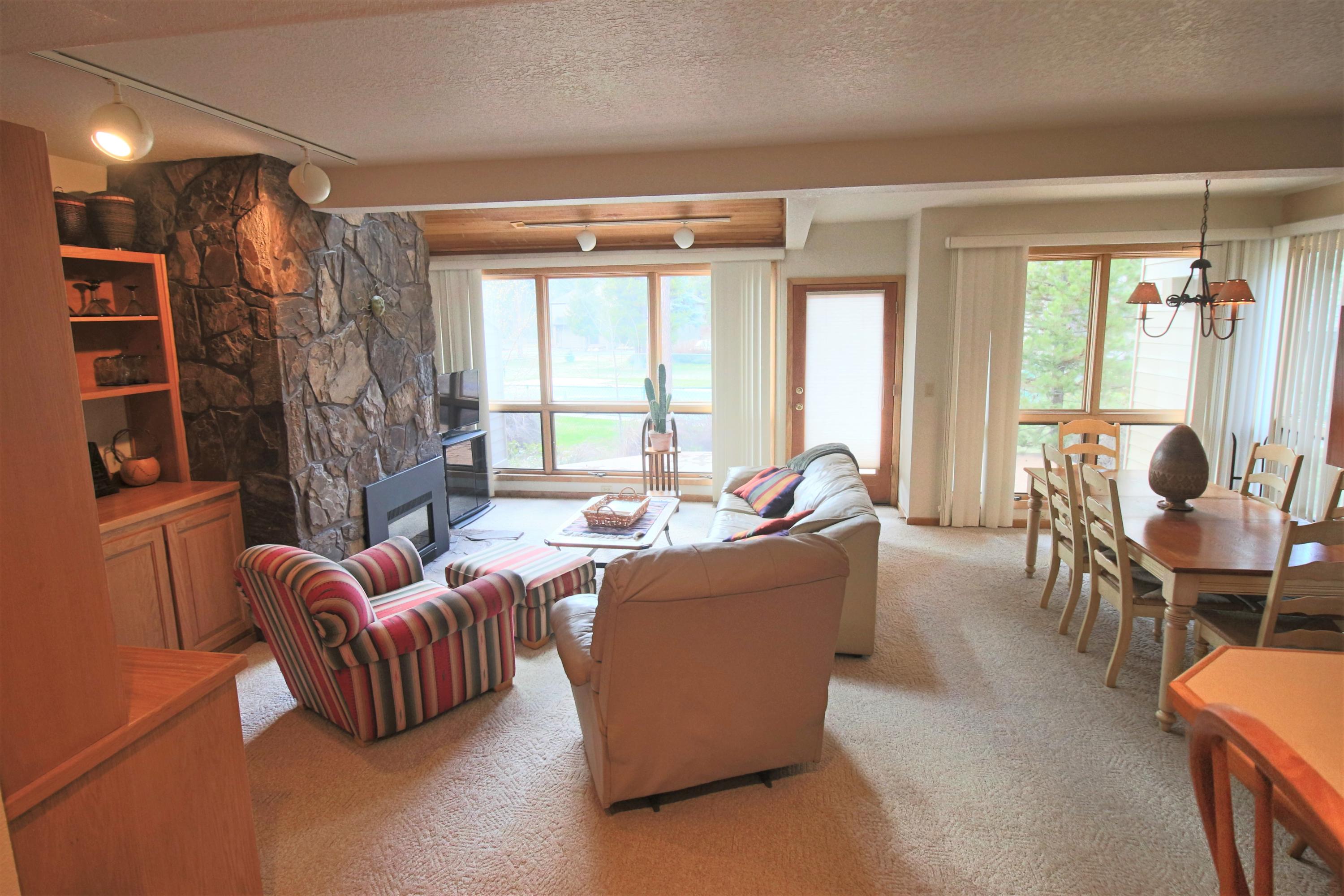 The wall of windows captures lots of afternoon sun, as do the decks. The cozy fireplace is perfect for taking the chill out of a winter's day.