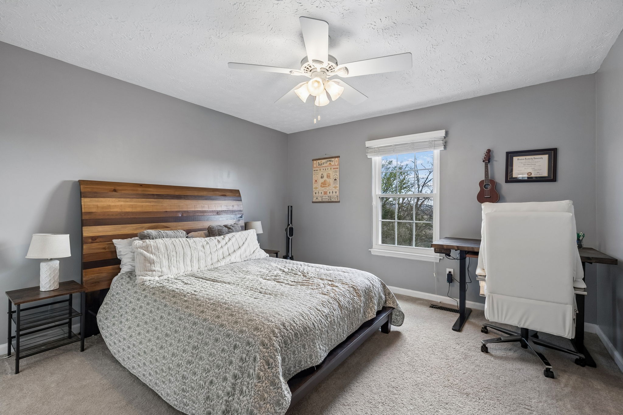 387 Huntington Ridge Drive Nashville, TN 37211 - Photo 24 of 46 a bedroom with a bed and a chandelier