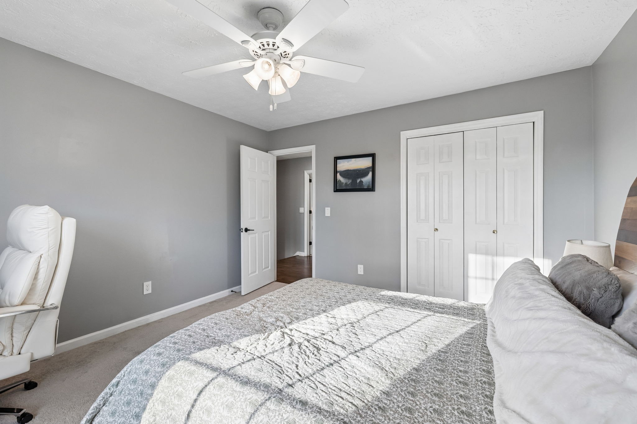 387 Huntington Ridge Drive Nashville, TN 37211 - Photo 25 of 46 a bedroom with a bed and a chandelier