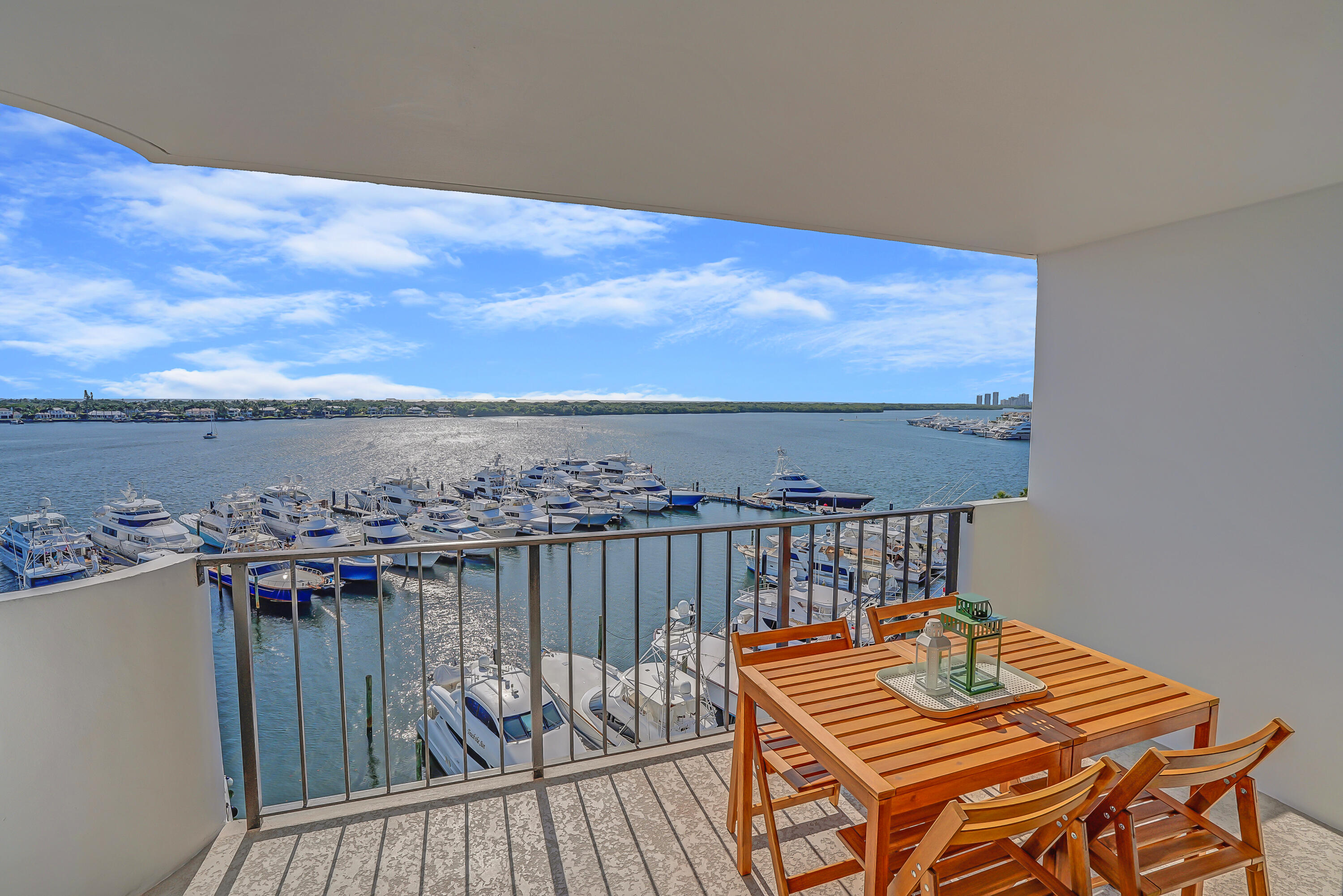 1208 Marine Way, Unit 602 North Palm Beach, FL 33408 - Photo 20 of 25 a view of a roof deck with two couches and wooden floor