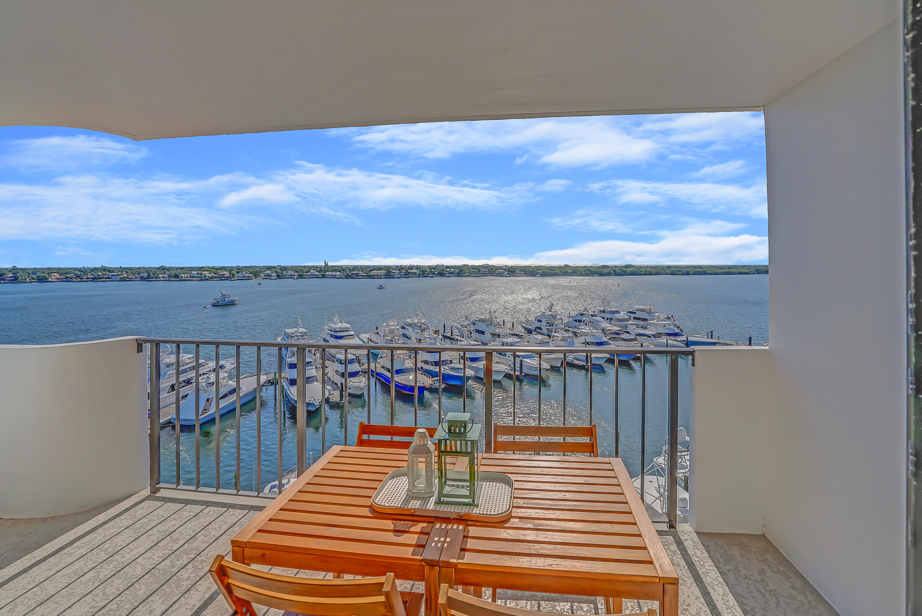 1208 Marine Way, Unit 602 North Palm Beach, FL 33408 - Photo 22 of 25 a view of a balcony with wooden floor and ocean view