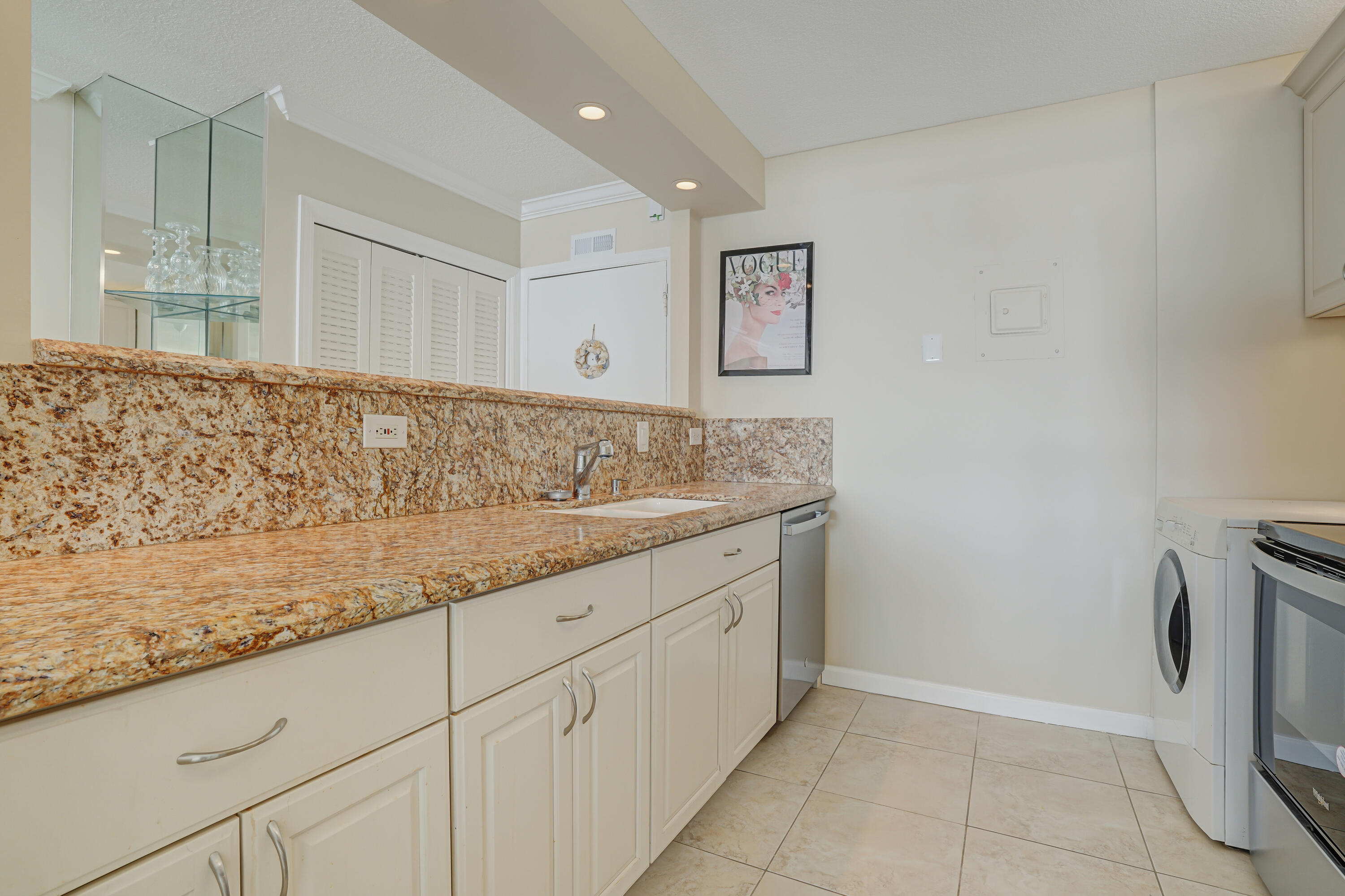 1208 Marine Way, Unit 602 North Palm Beach, FL 33408 - Photo 7 of 25 view of kitchen with granite countertop cabinets and sink