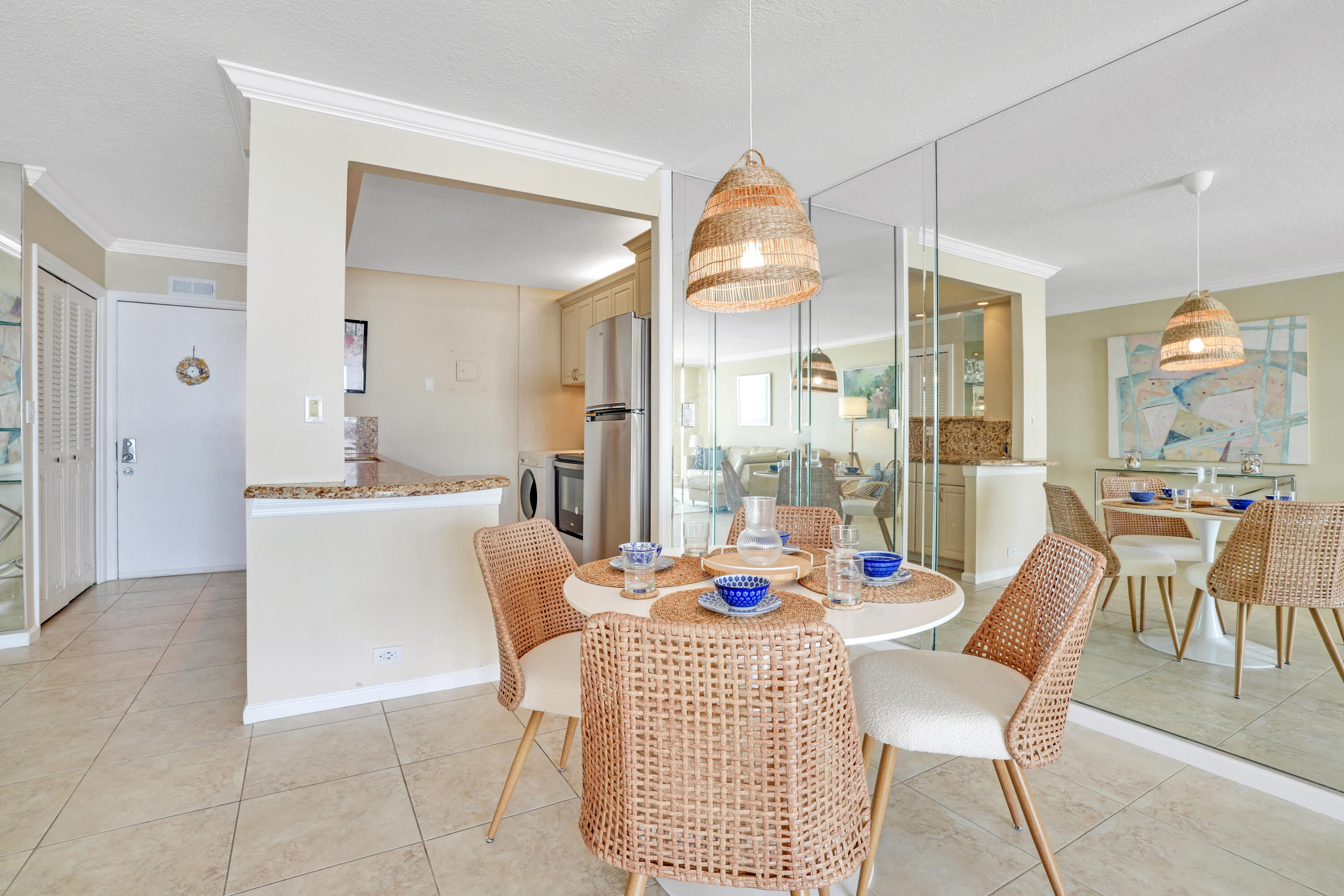 1208 Marine Way, Unit 602 North Palm Beach, FL 33408 - Photo 8 of 25 a dining room with furniture a chandelier and wooden floor