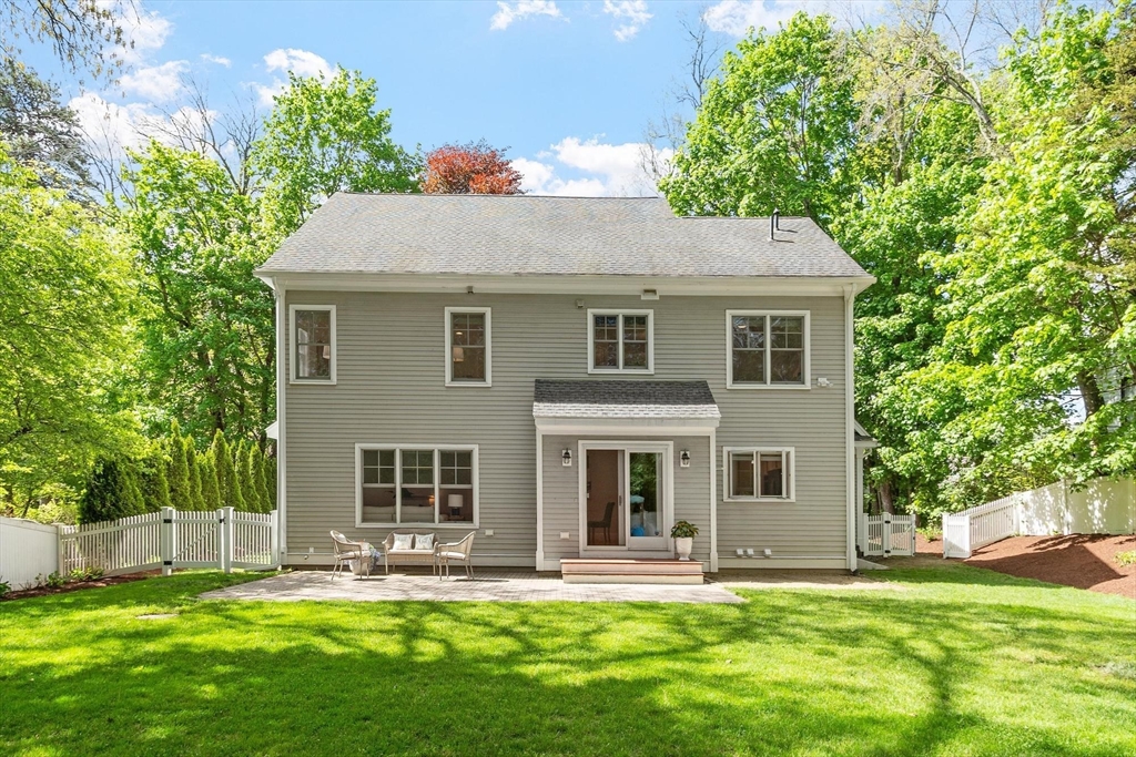 56 Old Marlboro Road Concord, MA 01742 - Photo 25 of 34 a front view of a house with a yard