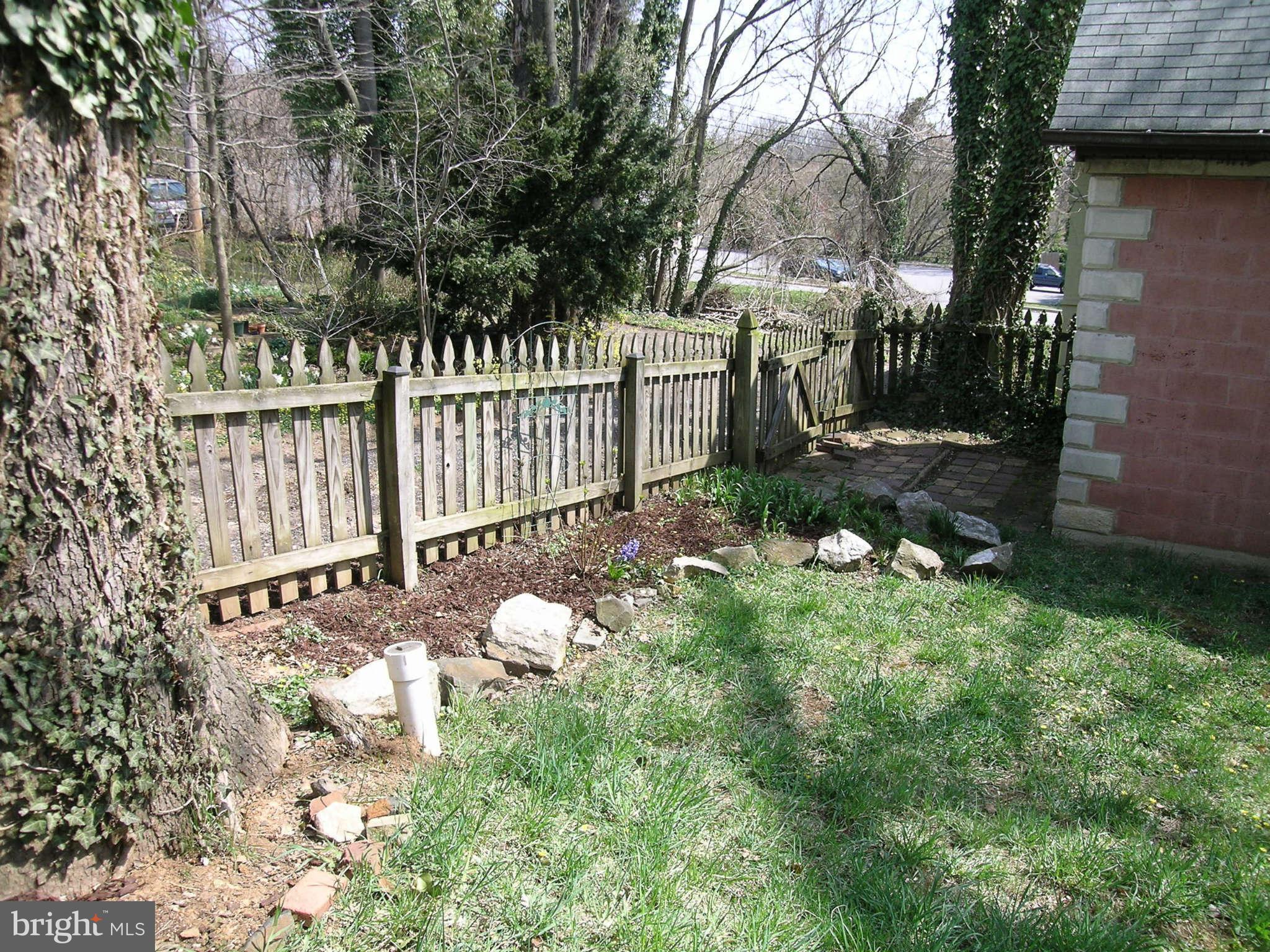 4505 Wilmslow Road Baltimore, MD 21210 - Photo 22 of 27 a view of a yard with wooden fence