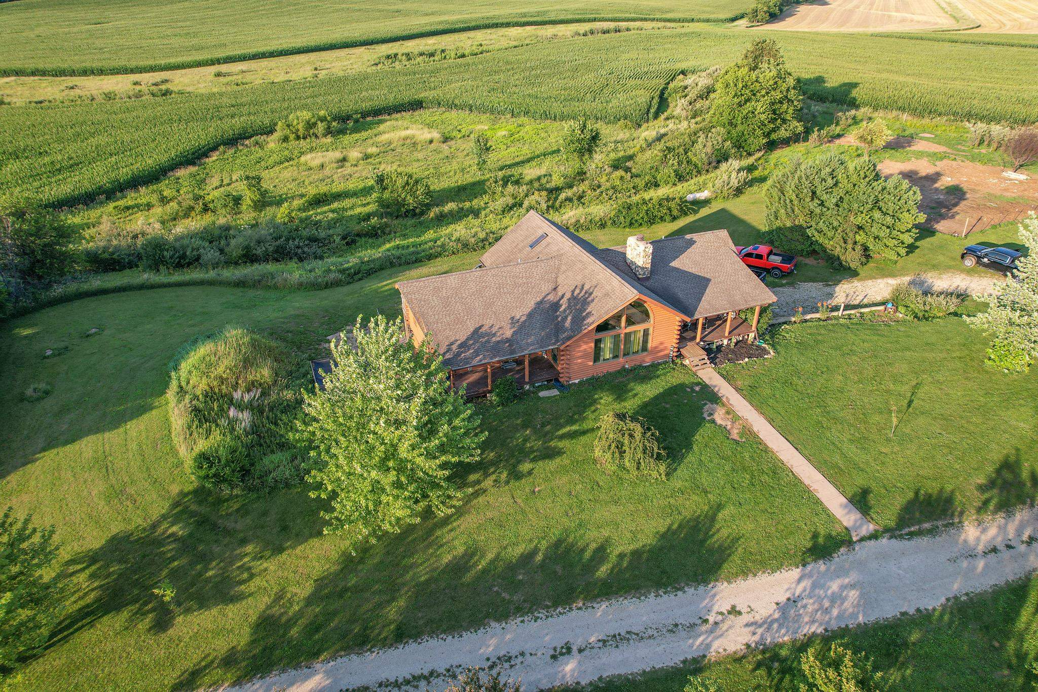 976 Paw Paw Road Paw Paw, IL 61353 - Photo 2 of 79 a aerial view of a house with a lake view