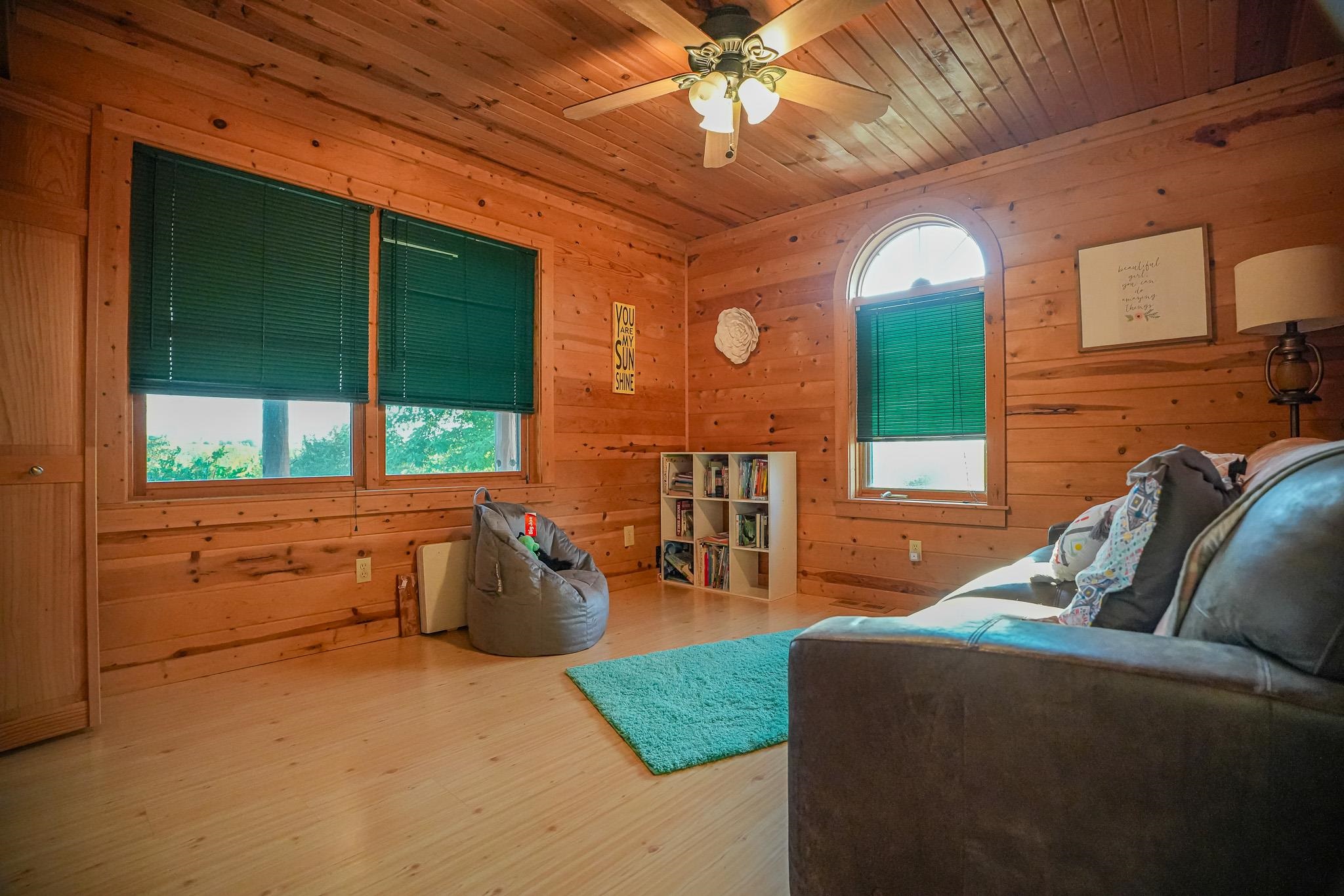 976 Paw Paw Road Paw Paw, IL 61353 - Photo 27 of 79 a living room with furniture and a large window