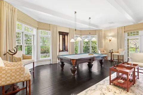 a dining room with furniture and windows