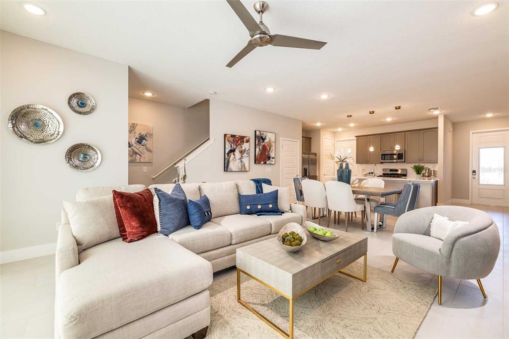 7920 Spectrum Drive Kissimmee, FL 34747 - Photo 5 of 13 a living room with furniture kitchen view and a table