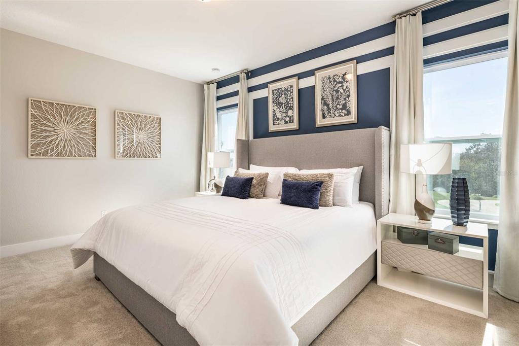 7920 Spectrum Drive Kissimmee, FL 34747 - Photo 7 of 13 a bedroom with bed and large window