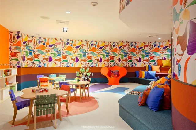 a living room with furniture potted plant and a window