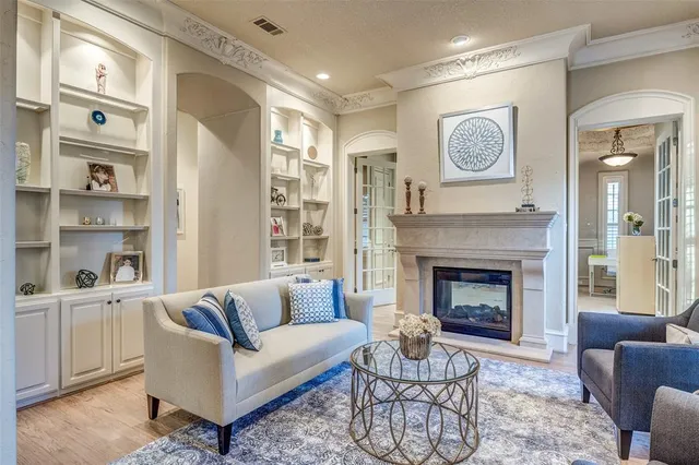 a bathroom with a granite countertop tub double vanity sink and a mirror