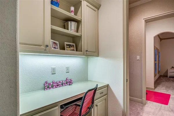 a view of a hallway with wooden floor and windows