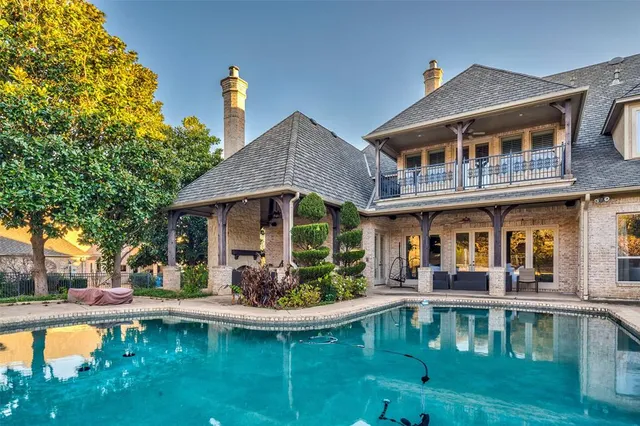 a front view of a house with swimming pool