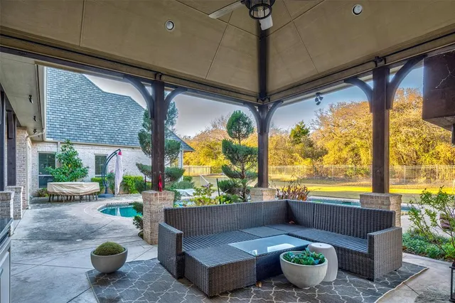 a house with swimming pool in front of it