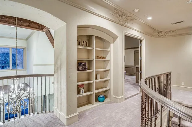 a view of a porch with a table and chairs