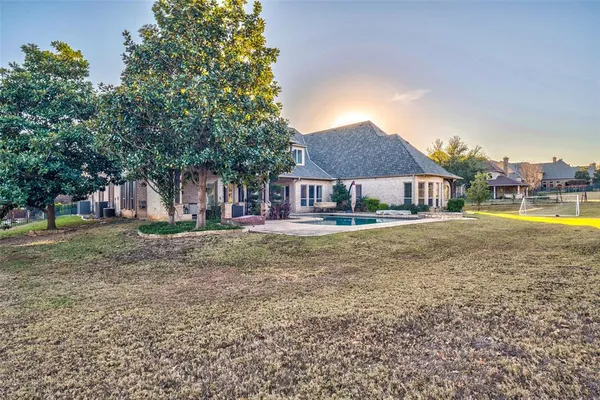 an aerial view of a house with a garden