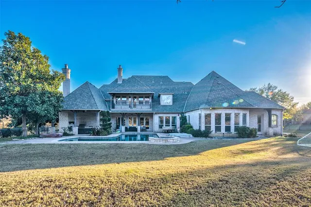 an aerial view of a house with garden space and street view