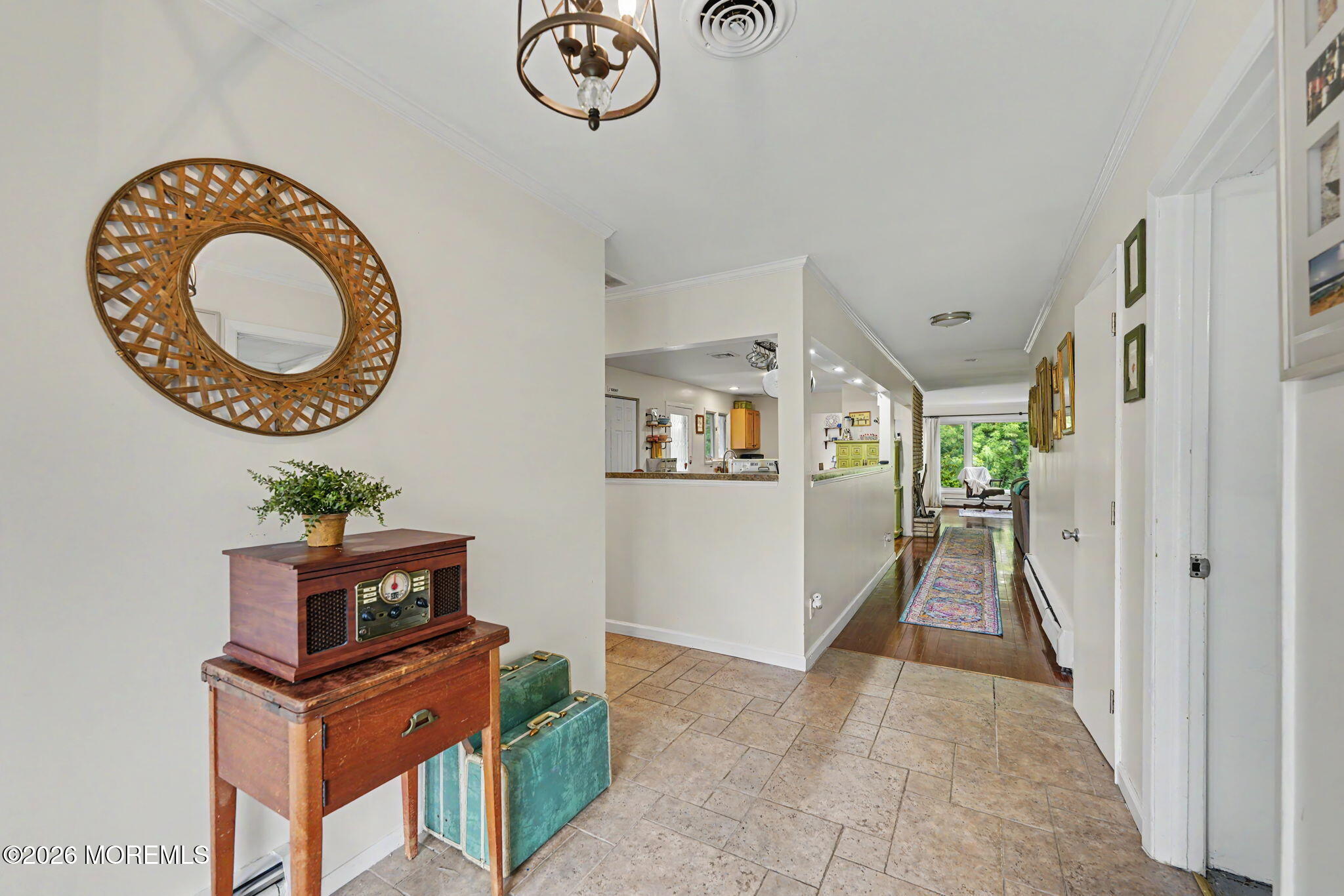 699 Aldrich Road Howell, NJ 07731 - Photo 5 of 30 a view of a hallway with washer and dryer