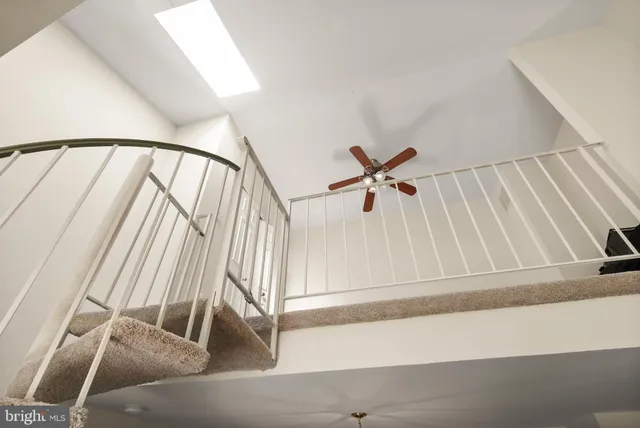 a view of staircase with white walls