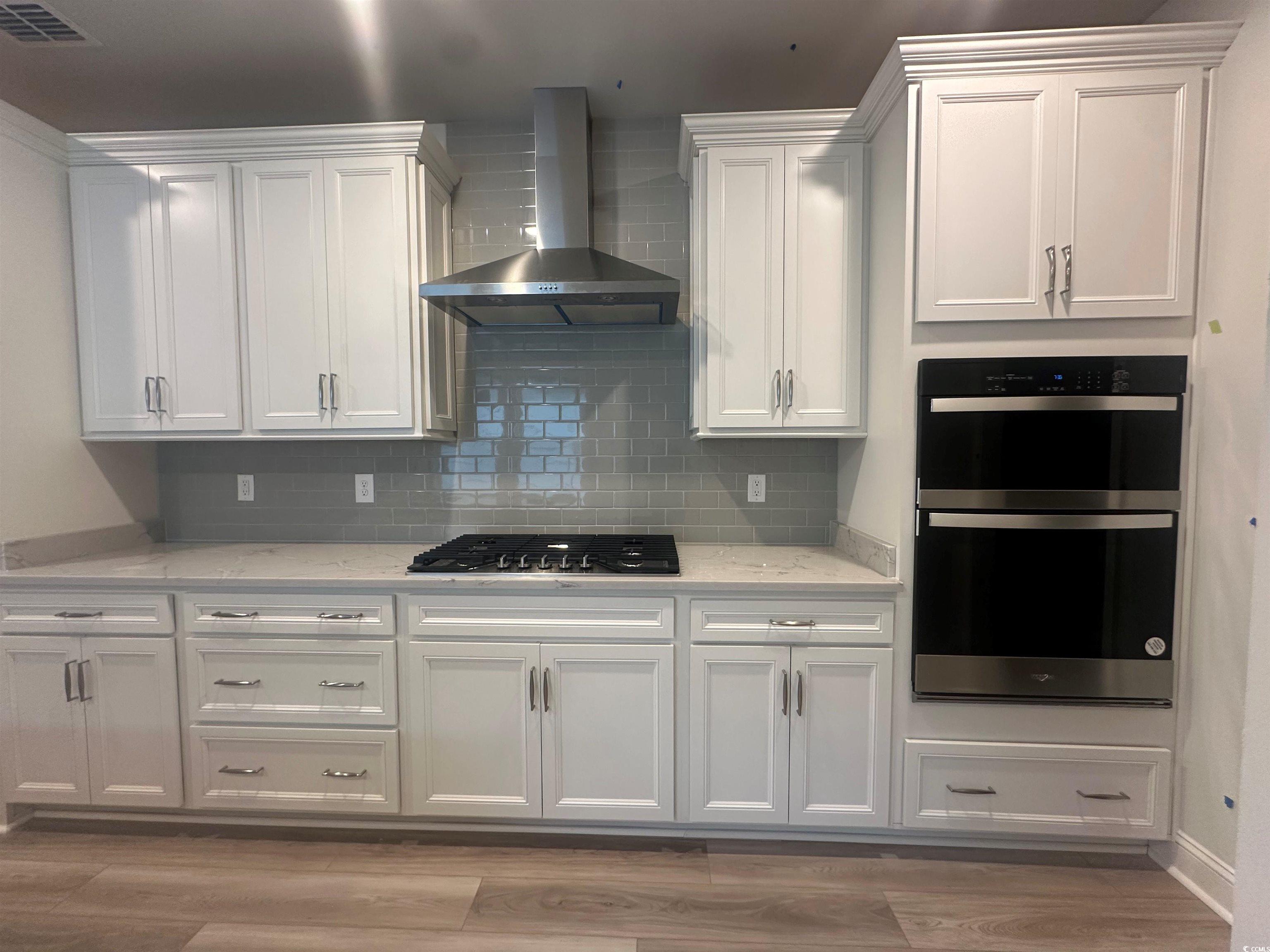 1541 Littleleaf Loop North Myrtle Beach, SC 29582 - Photo 3 of 19 Kitchen featuring light hardwood / LVP-style floor