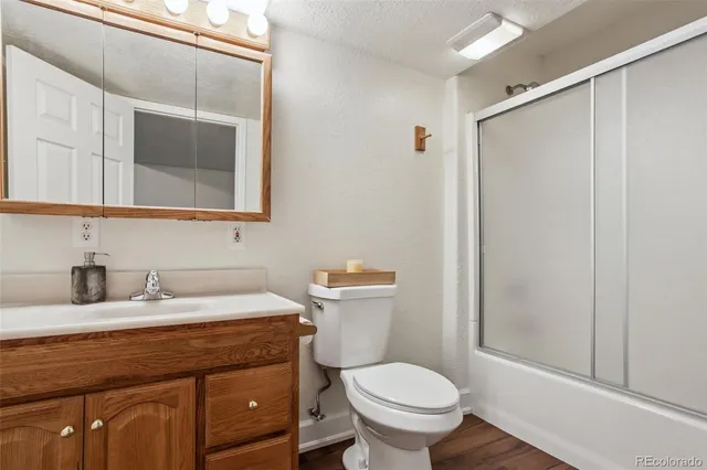 a view of a balcony with wooden floor