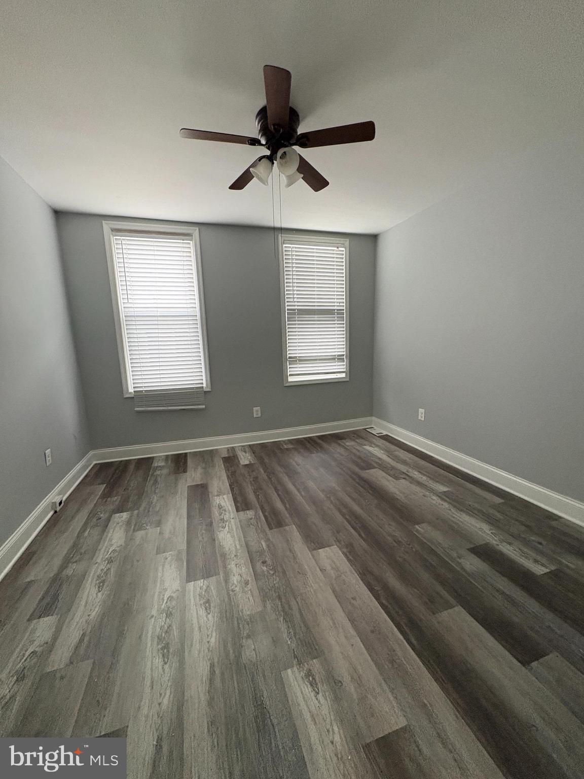 3413 Noble Street Baltimore, MD 21224 - Photo 14 of 43 wooden floor in an empty room with a window