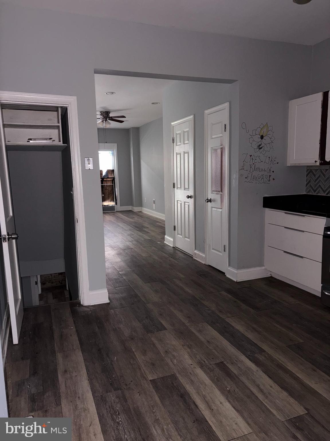 3413 Noble Street Baltimore, MD 21224 - Photo 23 of 43 a view of a hallway view with wooden floor and staircase