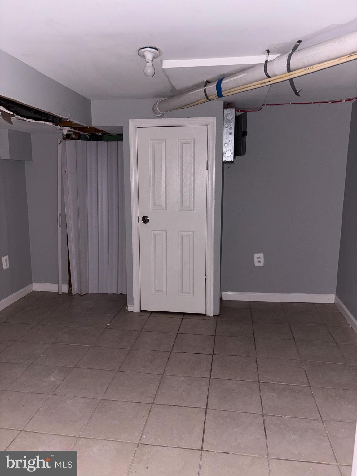 3413 Noble Street Baltimore, MD 21224 - Photo 33 of 43 a view of a closet area with an empty room