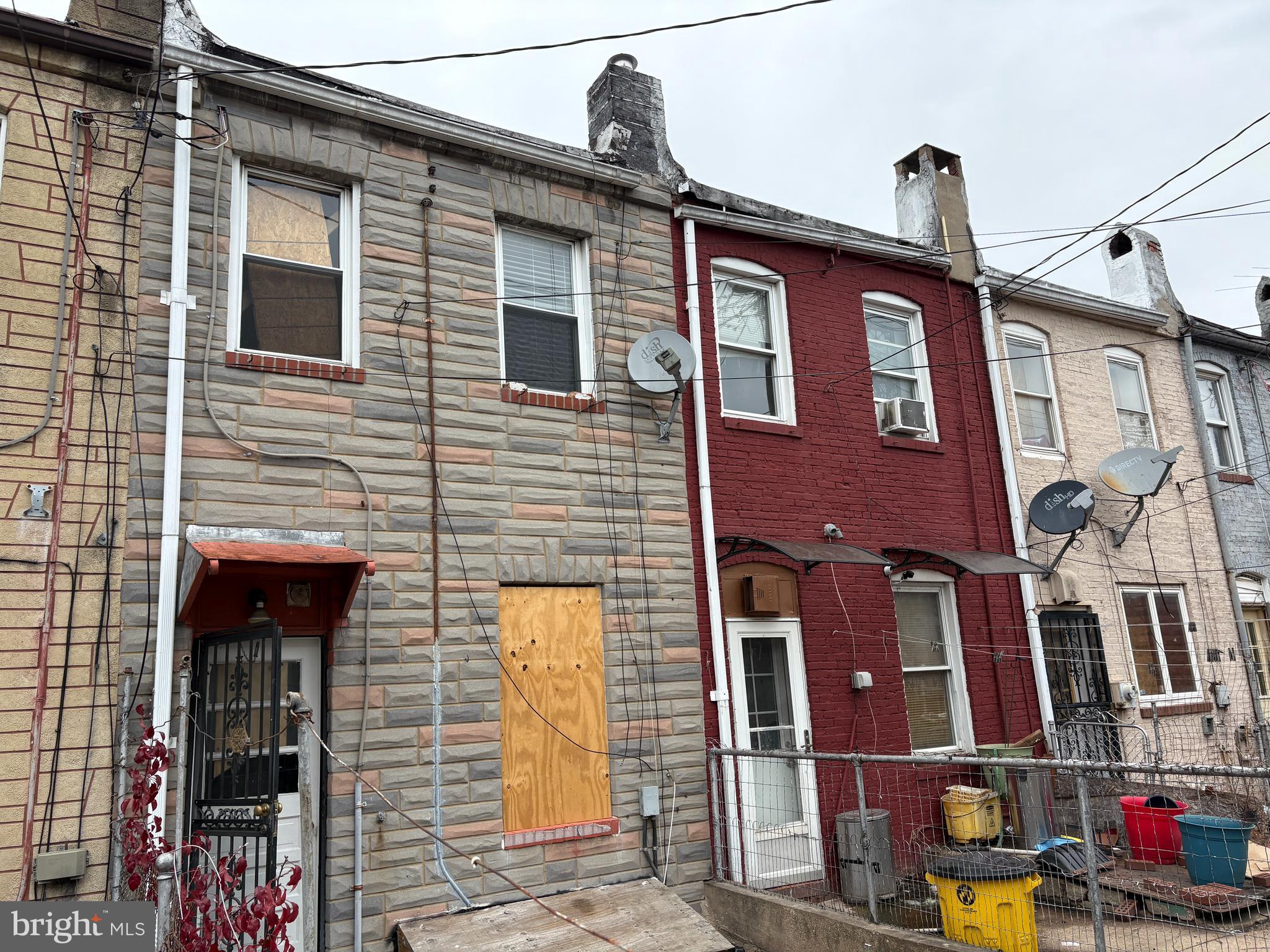 3413 Noble Street Baltimore, MD 21224 - Photo 42 of 43 a front view of a house with parking